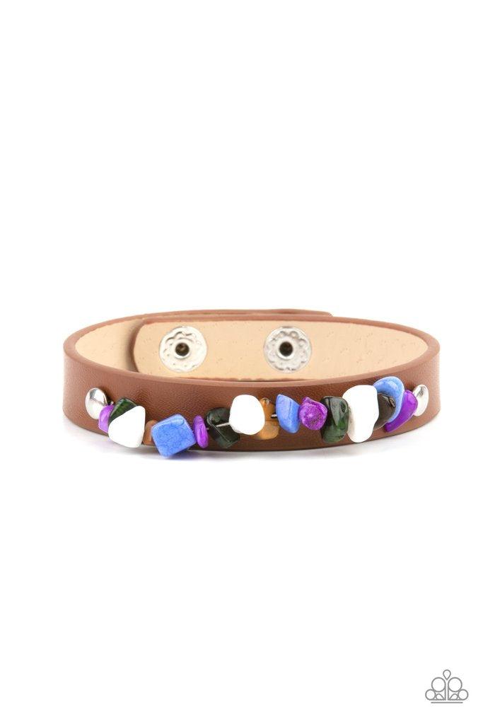 Paparazzi Accessories Pebble Paradise - Multi A strand of multicolored pebbles is studded in place across the front of a skinny brown leather band, creating a colorful earthy display around the wrist. Features an adjustable snap closure. Sold as one indiv