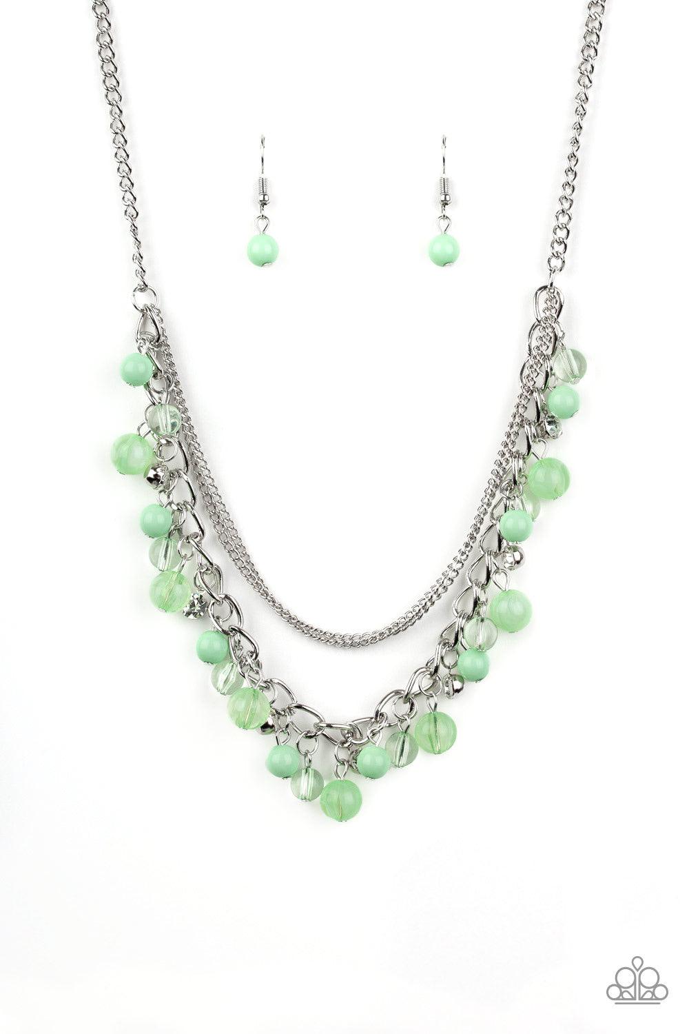 Paparazzi Accessories Wait And Sea - Green Infused with layers of mismatched silver chains, glassy, polished green, and glittery white rhinestones swing from the bottom of a bold silver chain, creating a bubbly fringe below the collar. Features an adjusta