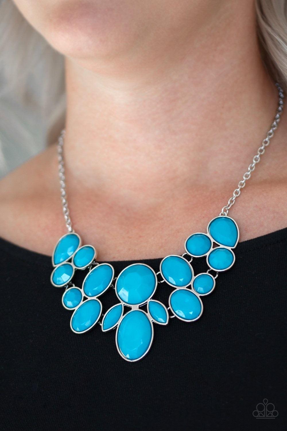 Paparazzi Accessories Demi Diva - Blue Featuring round, teardrop, and oval shapes, a collection of faceted blue beads are pressed into sleek silver frames. The colorful frames link below the collar creating a vibrant fashion. Features an adjustable clasp
