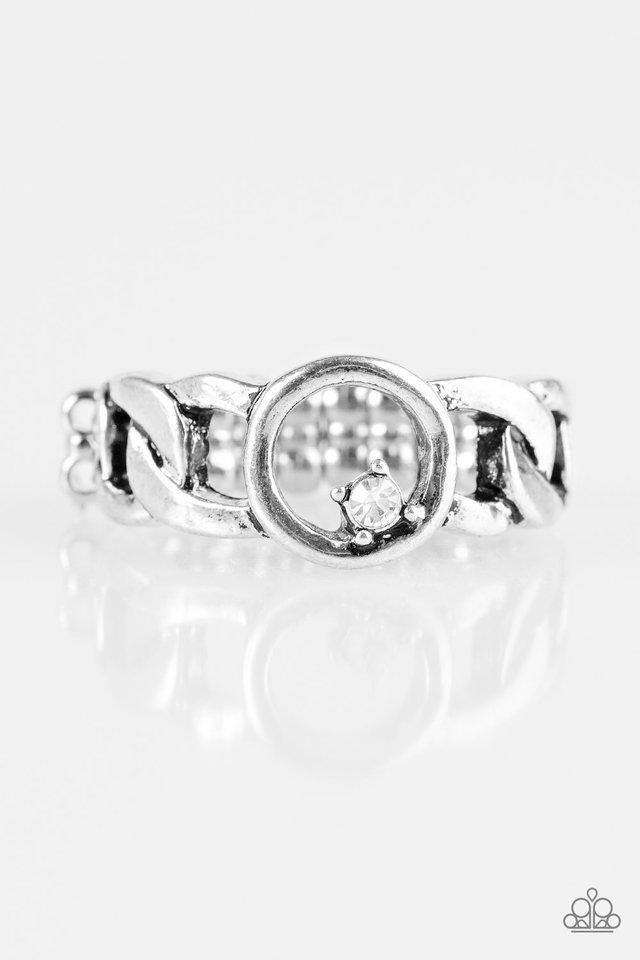 Paparazzi Accessories Rogue Sparkle - White Antiqued silver links join across the finger, creating an edgy band. A dainty white rhinestone asymmetrically dots the center link for a sassy finish. Features a dainty stretchy band for a flexible fit. Sold as
