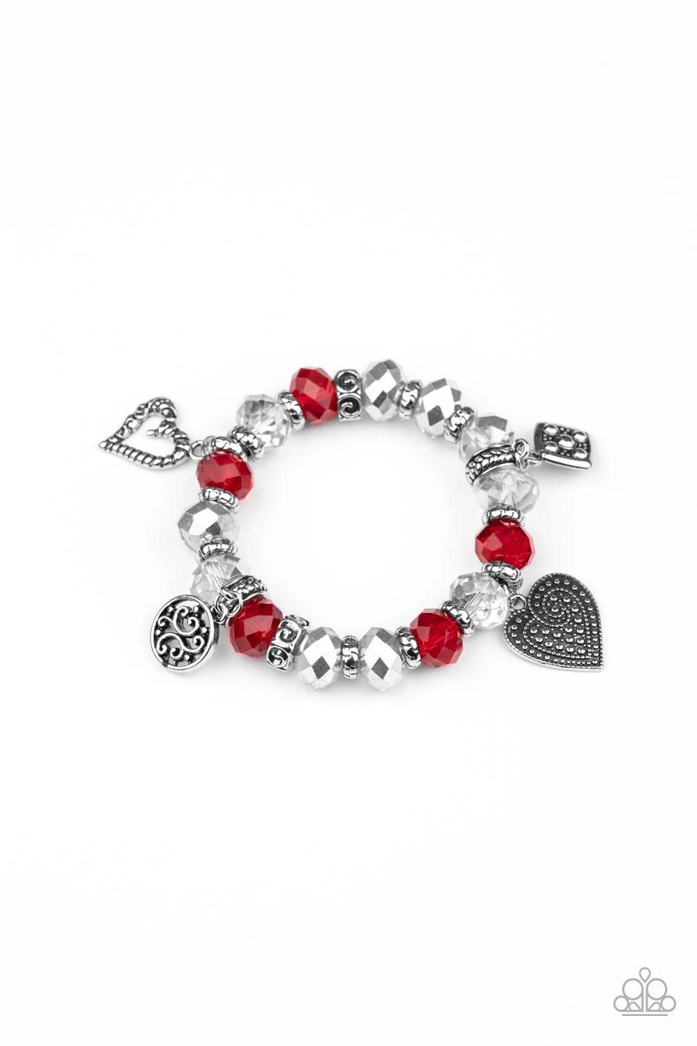 Paparazzi Accessories Fabulously Flirty - Red Dipped in metallic shimmer, smoky crystal-like beads, dainty silver rings, and red crystal-like beads are threaded along a stretchy band around the wrist. Decorative silver heart charms, a white rhinestone enc