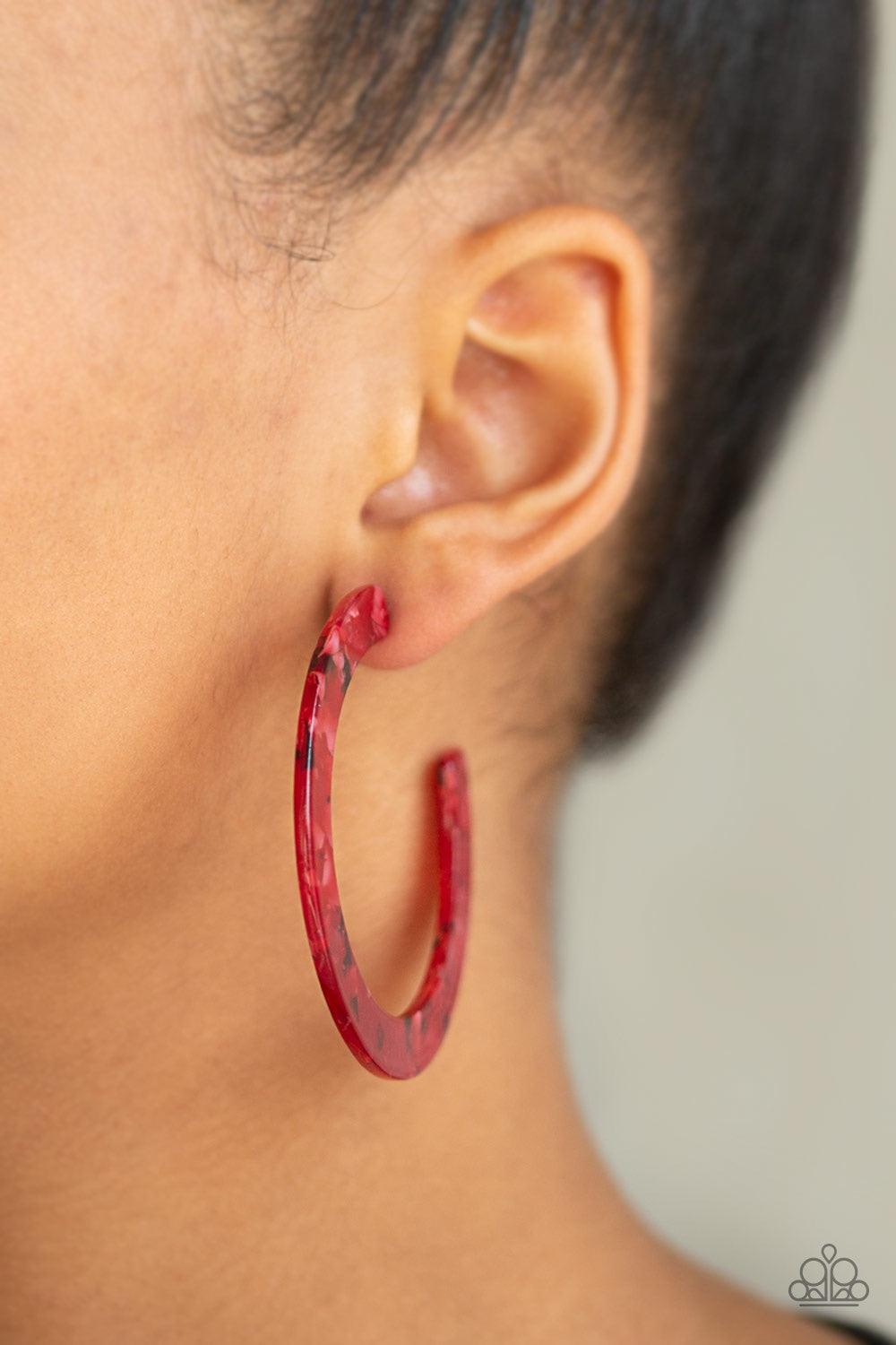 Paparazzi Accessories HAUTE Tamale - Red Featuring a faux-marble finish, a red acrylic hoop curls around the ear for a retro-radiant look. Earring attaches to a standard post fitting. Hoop measures approximately 2 1/4" in diameter. Jewelry