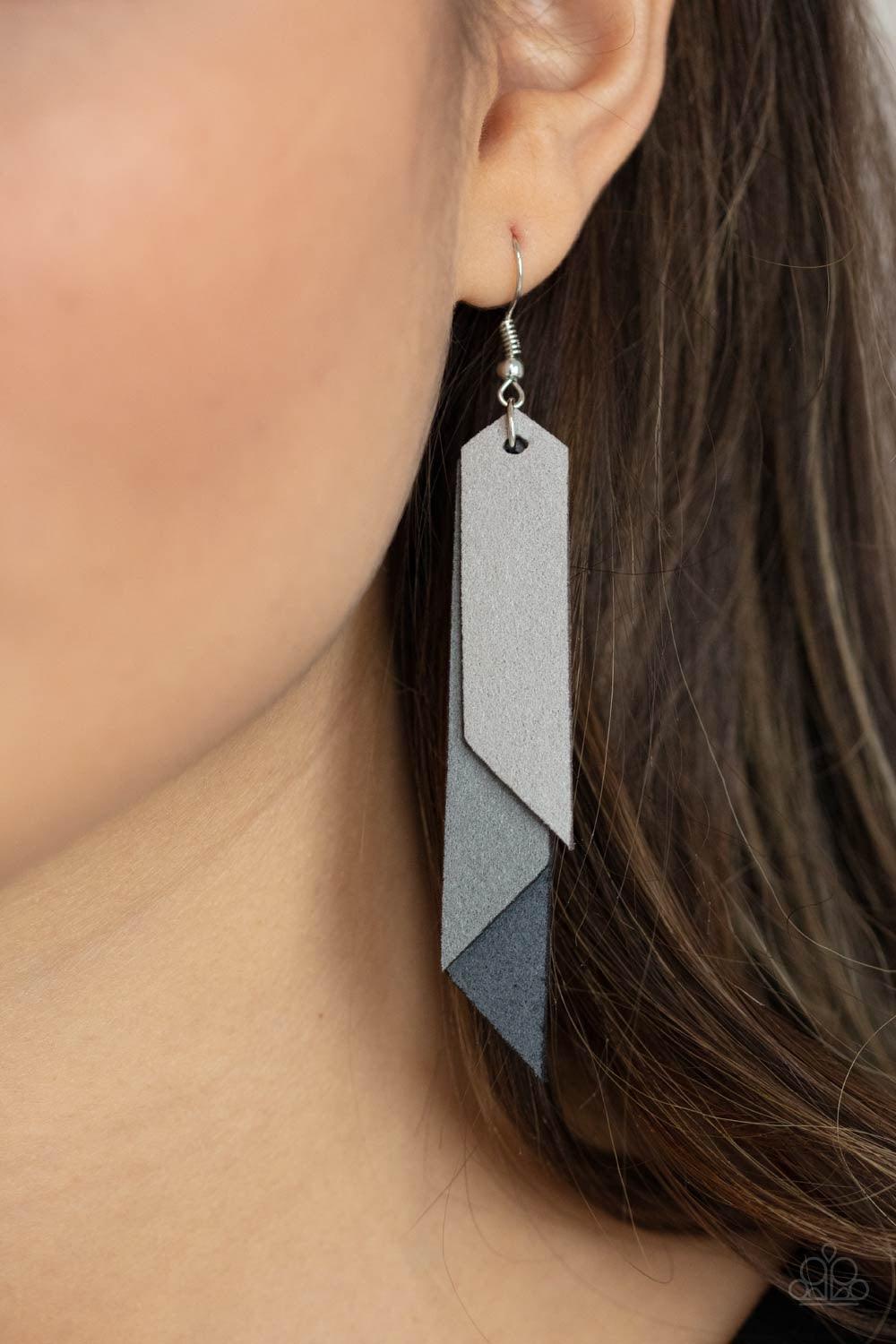 Paparazzi Accessories Suede Shade - Silver Featuring angled edges, an ombre of gray suede leather frames layer into a tapered tassel for an earthy effect. Earring attaches to a standard fishhook fitting. Sold as one pair of earrings. Jewelry