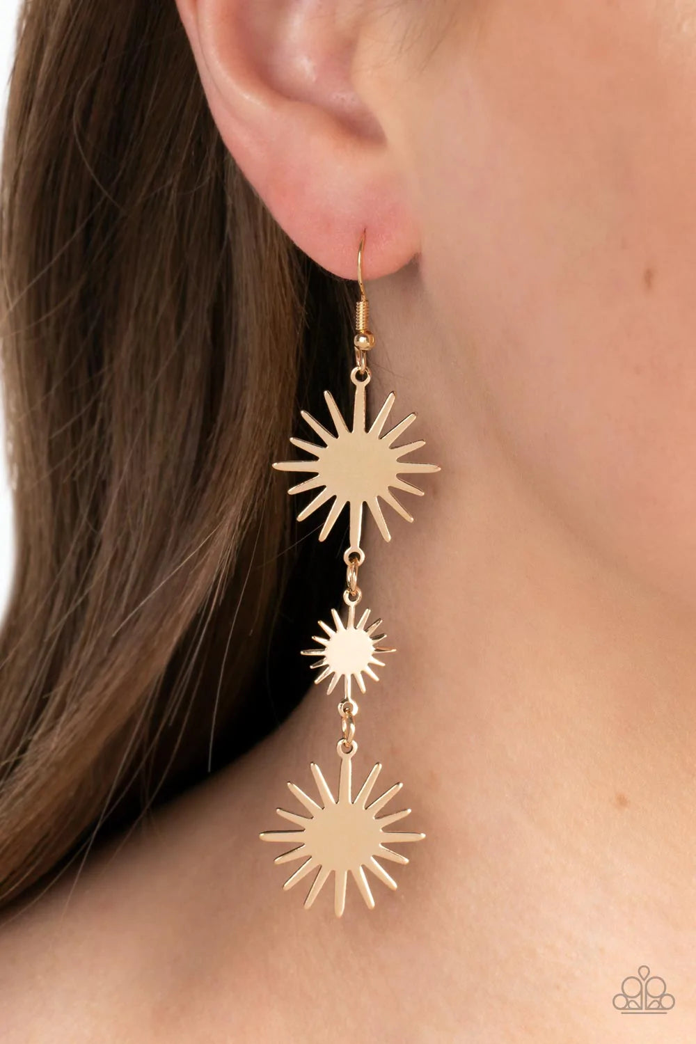 Paparazzi Accessories Solar Soul - Gold Varying in size, a trio of starry gold sunburst frames delicately links into a lengthened lure for a celestial vibe. Earring attaches to a standard fishhook fitting. Sold as one pair of earrings.