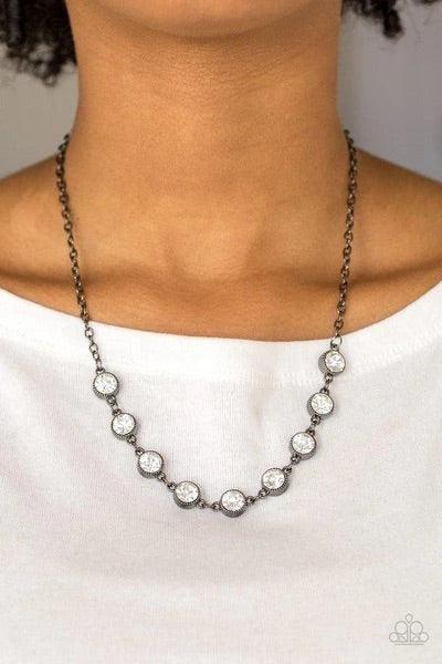 Paparazzi Accessories Starlit Socials - Black Encased in studded gunmetal frames, glittery white rhinestones link below the collar for a glamorous look. Features an adjustable clasp closure. Sold as one individual necklace. Includes one pair of matching e
