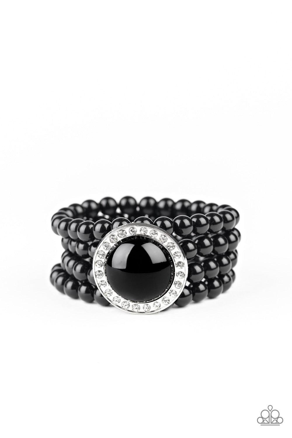 Paparazzi Accessories Top Tier Twinkle - Black Threaded along stretchy bands, row after row of black beads are held in place by an exaggerated black beaded frame encrusted in glassy white rhinestones for a refined finish. Sold as one individual bracelet.