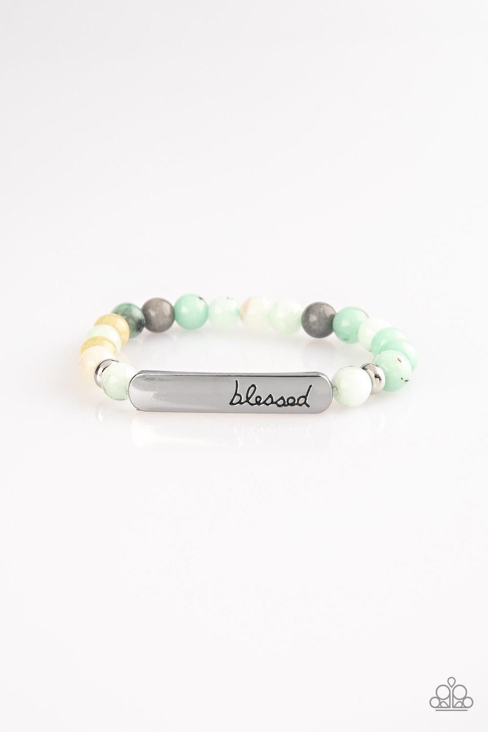 Paparazzi Accessories Born Blessed - Green Infused with dainty silver accents, a collection of colorful natural stones are threaded along a stretchy band. A glistening silver frame engraved with the word, "blessed" adorns the center for a seasonal finish.