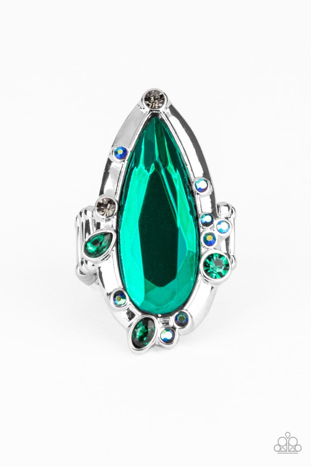Paparazzi Accessories Sparkle Smitten - Green Varying in color and shape, mismatched green iridescent rhinestones sporadically dot the front of a shiny silver teardrop frame. Featuring a flashy faceted surface, an oversized green teardrop gem adorns the c