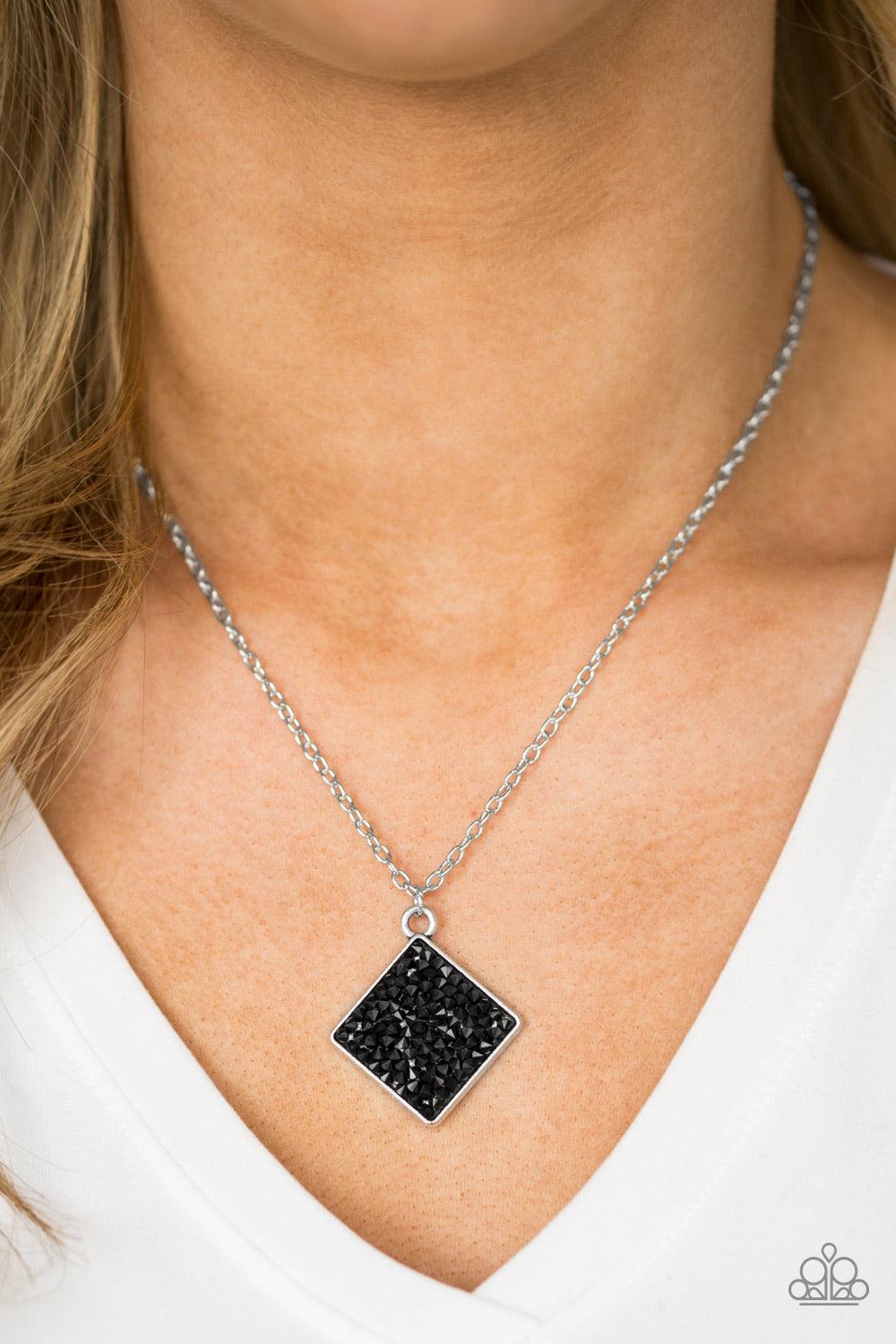 Paparazzi Accessories Kickin Up STARDUST - Black Glittery black rhinestones are sprinkled along a square silver frame, creating a dramatic pendant below the collar for a glamorous look. Features an adjustable clasp closure. Sold as one individual necklace