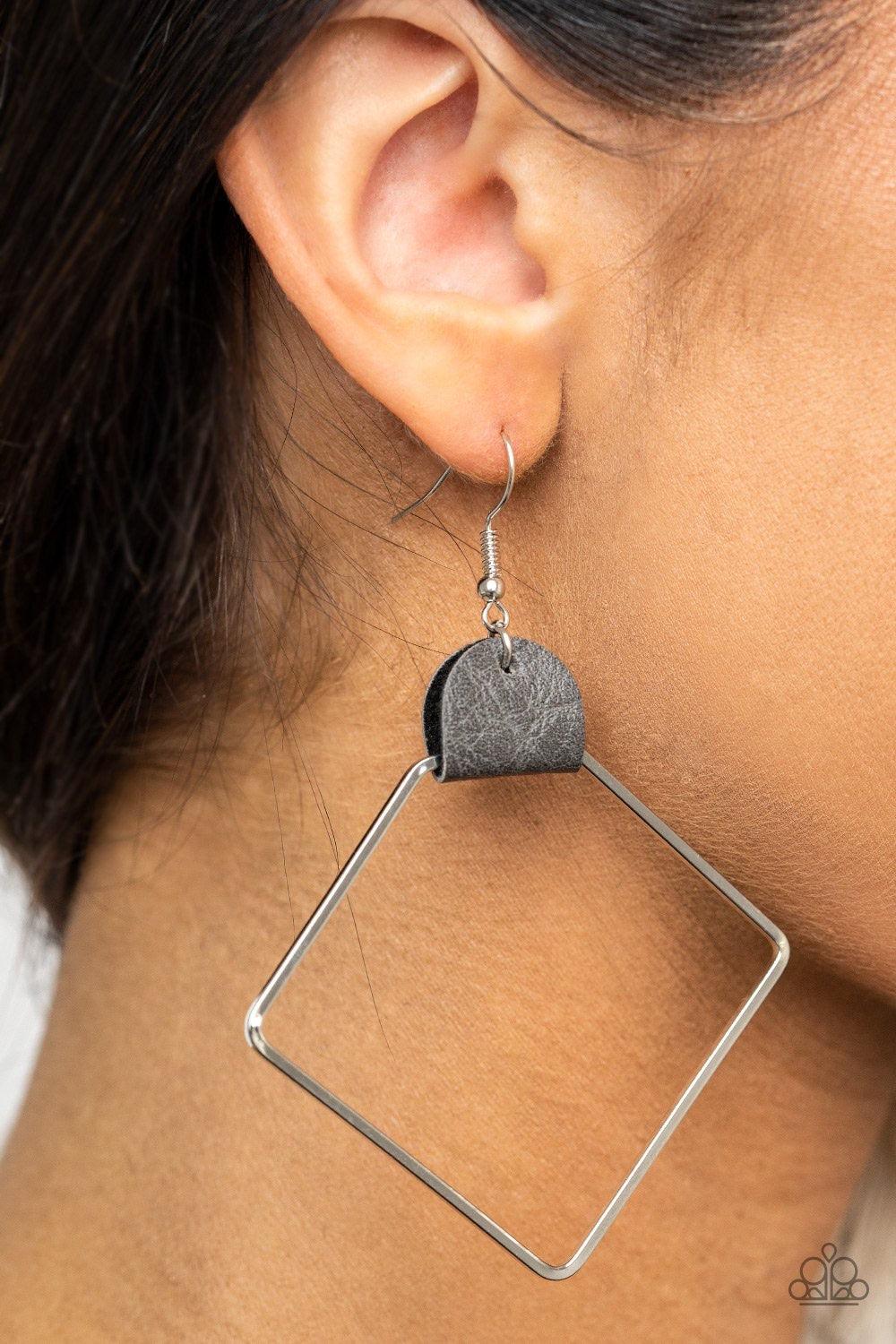 Paparazzi Accessories Friends of a Leather - Silver An airy geometric silver hoop is pinched between a dainty piece of gray leather, creating an edgy lure. Earring attaches to a standard fishhook fitting. Sold as one pair of earrings. Jewelry
