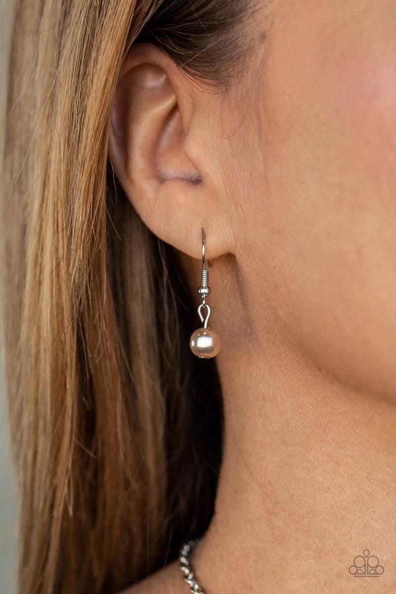 Paparazzi Accessories Coastal Cache - Mutli Pearly white and brown beads, aurum crystal-like gems, and hammered silver discs swing from a bold silver chain, creating a refined fringe below the collar. Features an adjustable clasp closure. Sold as one indi