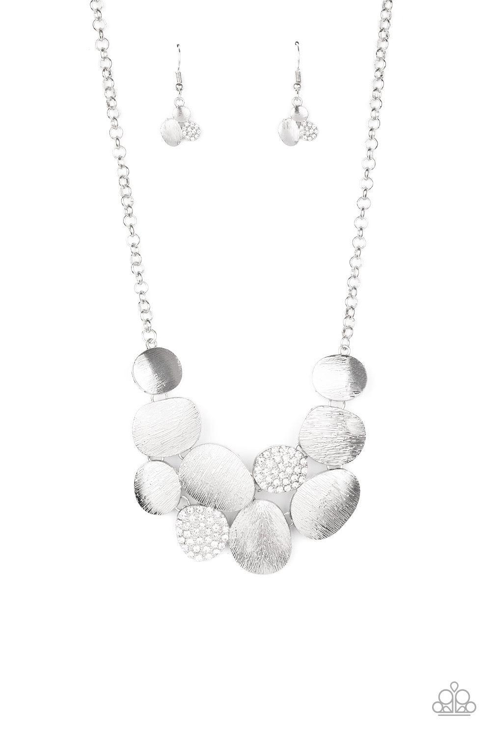 Paparazzi Accessories A Hard LUXE Story - White Featuring imperfect oval shapes, a series of delicately scratched and white rhinestone encrusted frames connect into a clustered pendant below the collar for a refined flair. Features an adjustable clasp clo