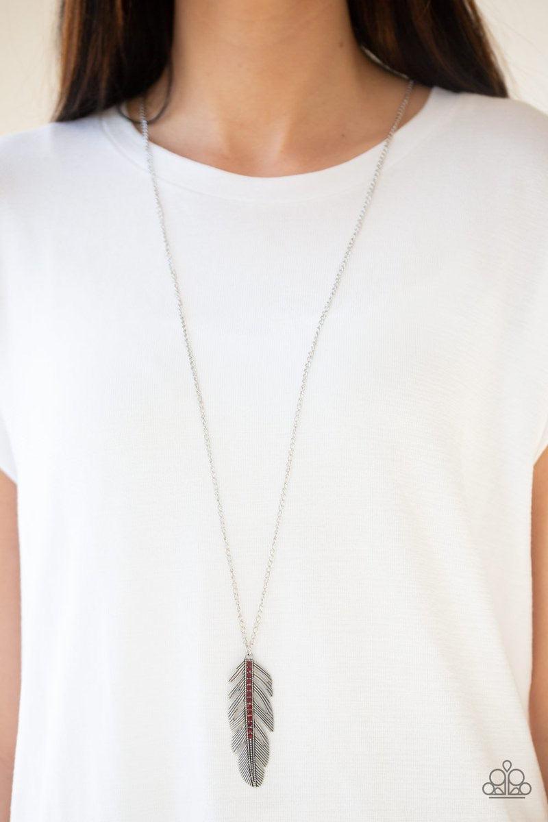 Paparazzi Accessories Sky Quest - Red Glittery red rhinestones are encrusted down the spine of a life-like silver feather. The whimsical pendant swings from the bottom of a lengthened silver chain for a seasonal look. Features an adjustable clasp closure.