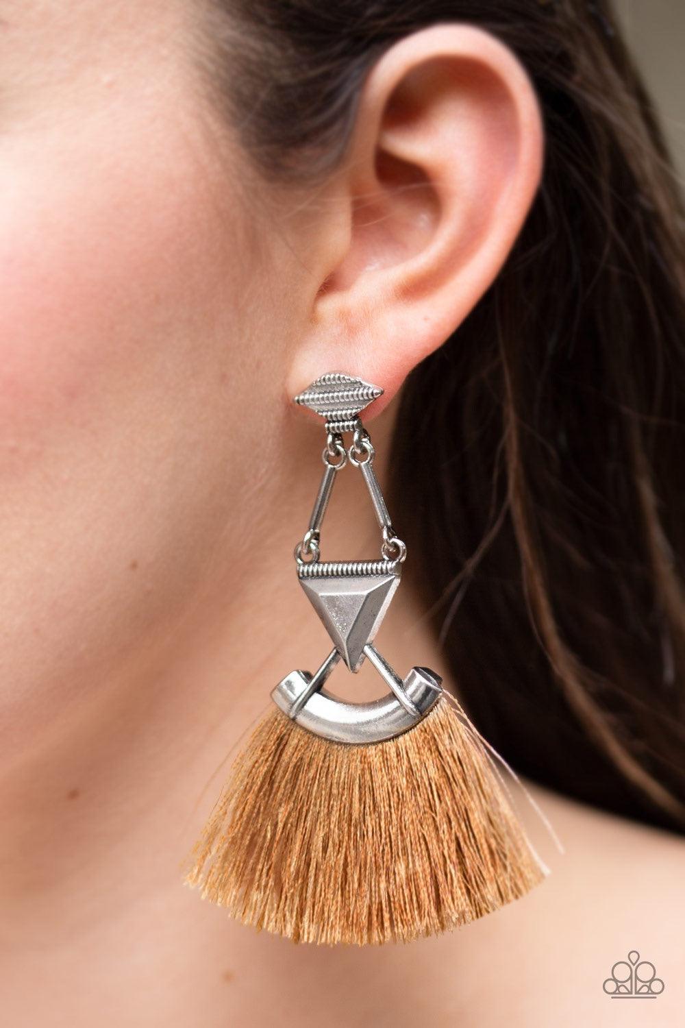 Paparazzi Accessories Puma Prowl - Brown An assortment of geometric silver frames connect into an edgy lure. A fan of shiny brown thread flares from the bottom of the stacked frame for a funky finish. Earring attaches to a standard post earring. Jewelry