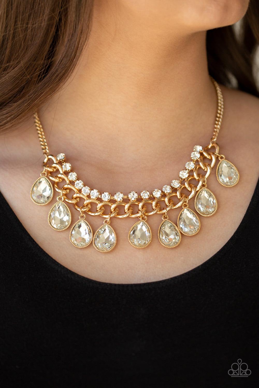 Paparazzi Accessories All Toget-HEIR Now - Gold Teardrop rhinestones swing from the bottom of a bold gold chain, creating a dramatic fringe below the collar. A strand of glittery white rhinestones attach to the top of a shimmery gold chain, adding a refin