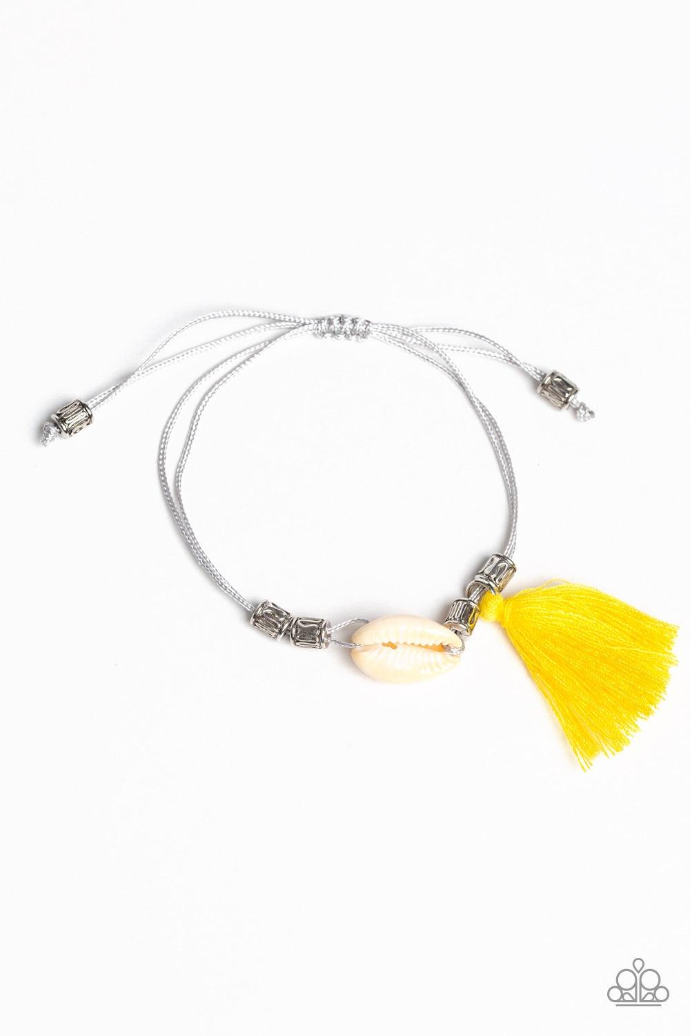 Paparazzi Accessories SEA If I Care - Yellow Infused with antiqued silver beads, a yellow threaded tassel and dainty white seashell slide along strips of shiny gray cording around the wrist for a summery look. Features an adjustable sliding knot closure.
