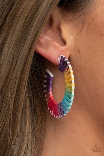 Paparazzi Accessories Everybody Conga! - Multi Multicolored wicker-like cording is wrapped around a white hoop, creating a vivacious pop of color. Earring attaches to a standard post fitting. Hoop measures approximately 1 3/4" in diameter. Sold as one pai