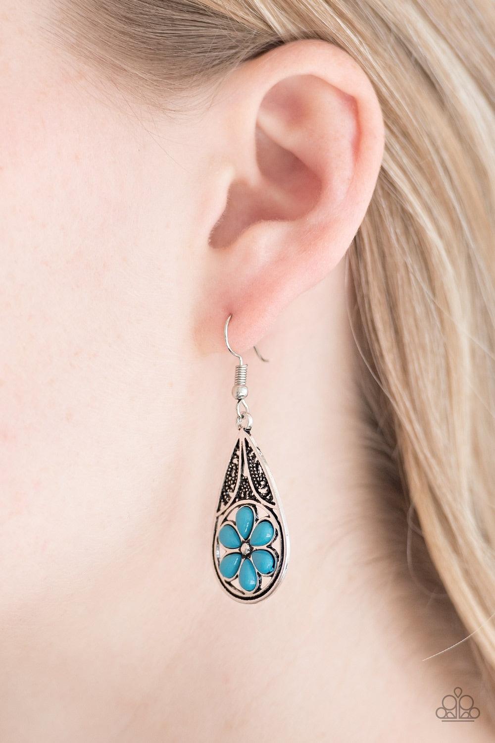 Paparazzi Accessories Countryside Cottage - Blue Refreshing blue beads are pressed into the bottom of an ornate silver teardrop, creating a whimsical floral pattern. Earring attaches to a standard fishhook fitting. Jewelry