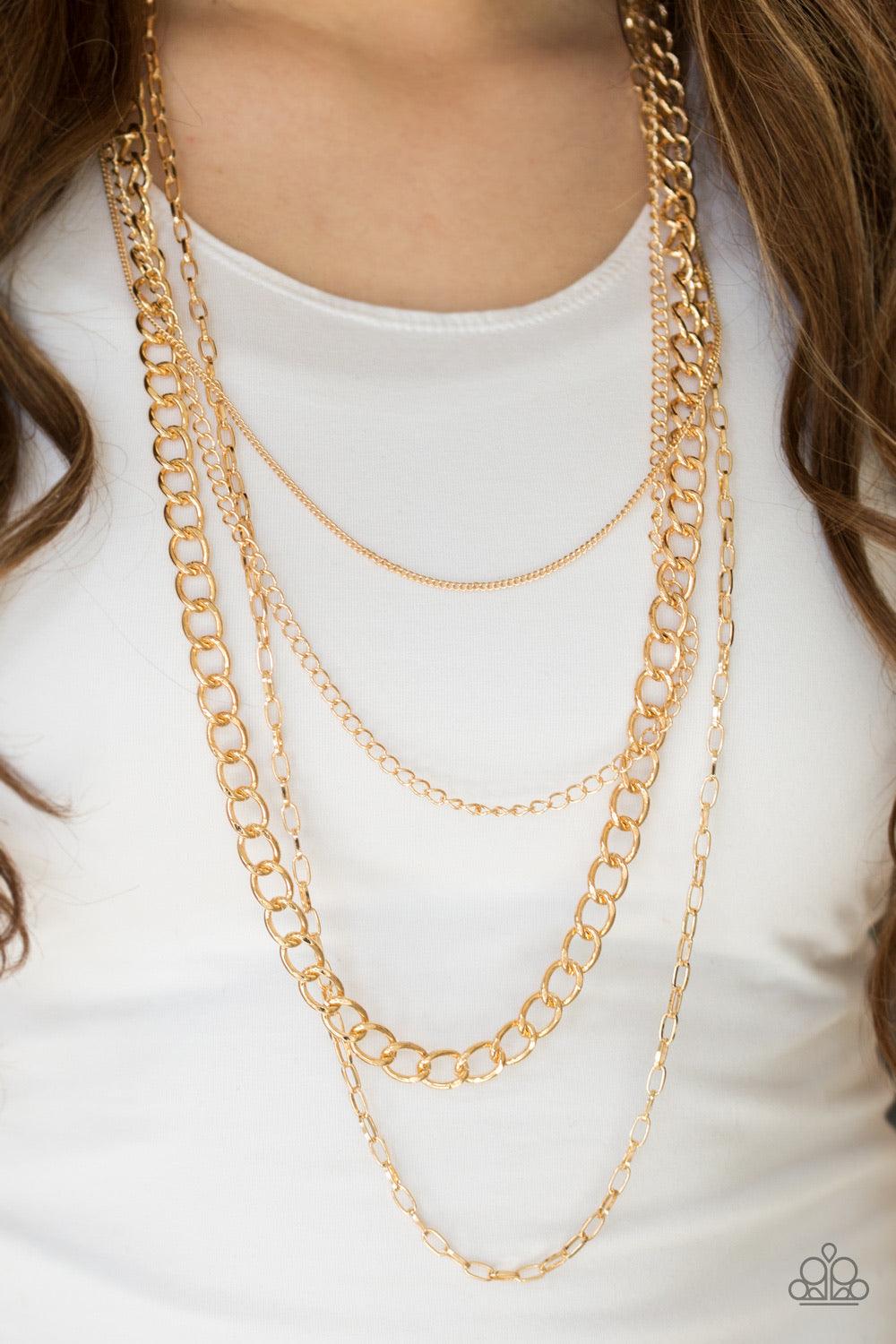 Paparazzi Accessories Metro Metal - Gold A mishmash of gold chains drape across the chest for a collision of edgy textures. Features an adjustable clasp closure. Sold as one individual necklace. Includes one pair of matching earrings. Jewelry