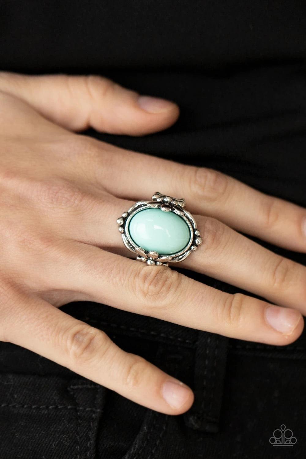 Paparazzi Accessories Springtime Splendor - Blue Featuring leafy silver fittings, a bubbly blue bead is pressed into the center of a studded silver frame for a trendy pop of color. Features a stretchy band for a flexible fit. Sold as one individual ring.
