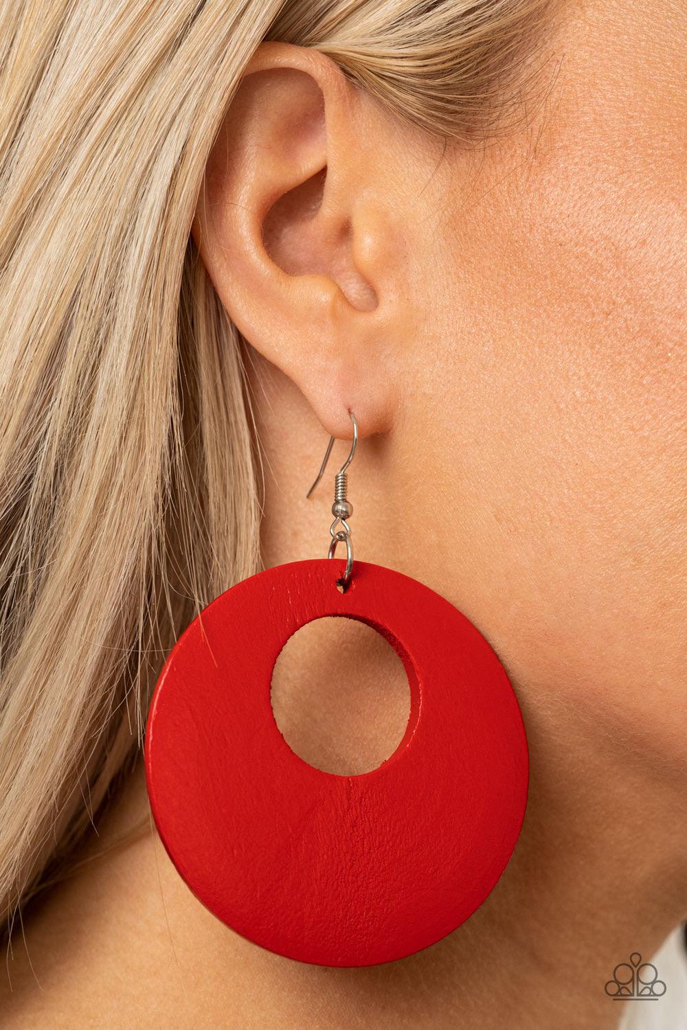 Paparazzi Accessories Island Hop - Red Painted in a fiery red hue, an oversized wooden hoop-like frame swings from the ear for a colorful look. Earring attaches to a standard fishhook fitting. Sold as one pair of earrings. Jewelry