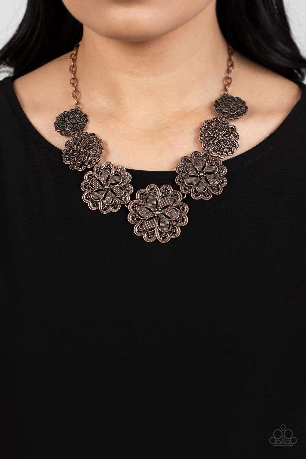 Paparazzi Accessories Basketful Of Blossoms - Copper Featuring metallic wicker-like patterns, stacks of teardrop and heart shaped filigree-filled copper petals delicately link into a decorative row of flowers. The floral frames gradually increase in size
