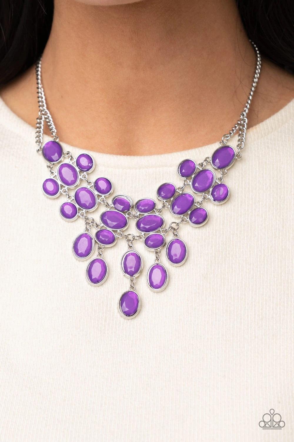 Paparazzi Accessories Serene Gleam - Purple A stunning array of oval cut Amethyst Orchid gems, pressed into silver frames, interconnect into a spectacular princess-like bib design. The display rests just below the collar for an exquisitely serene gleam. F