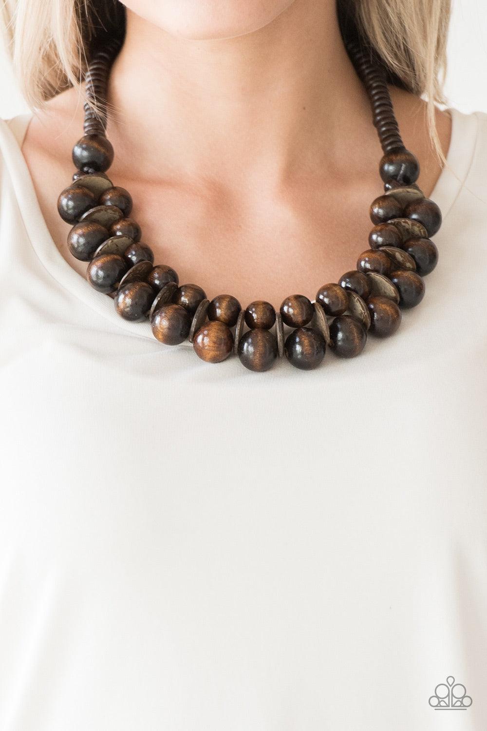 Paparazzi Accessories Caribbean Cover Girl - Brown Brushed in a distressed finish, earthy brown wooden beads and discs join below the collar for a summery look. Features a button loop closure. Jewelry