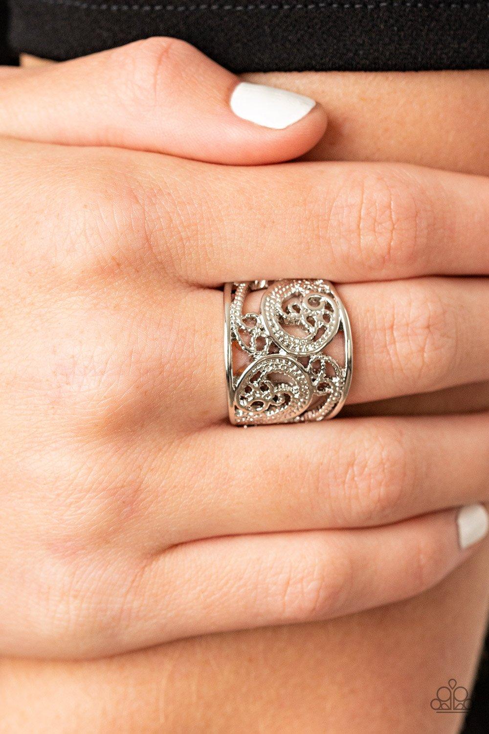 Paparazzi Accessories Turning The Tides - Silver Featuring a shiny silver finish, smooth and dotted filigree patterns whirl and swirl across the finger for a whimsical fashion. Features a stretchy band for a flexible fit. Sold as one individual ring. Jewe