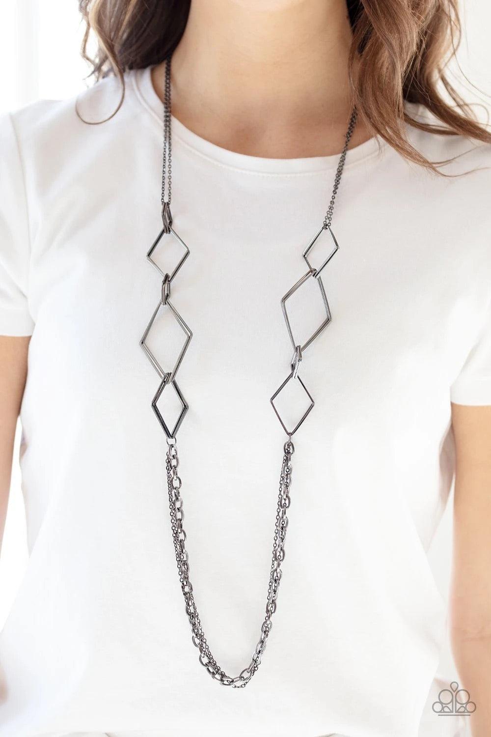 Paparazzi Accessories Fashion Fave - Black A collection of interlocking diamond-shaped frames give way to rows of mismatched gunmetal chains, creating edgy layers across the chest. Features an adjustable clasp closure. Sold as one individual necklace. Inc