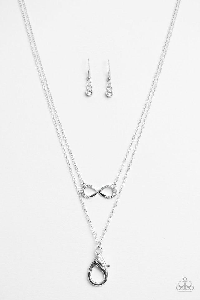 Paparazzi Accessories Forever Glamorous - White *Lanyard Encrusted in sections of glittery white rhinestones, a dainty silver ribbon swirls into a glistening infinity charm below the collar in a timeless fashion. A lobster clasp hangs from the bottom of t