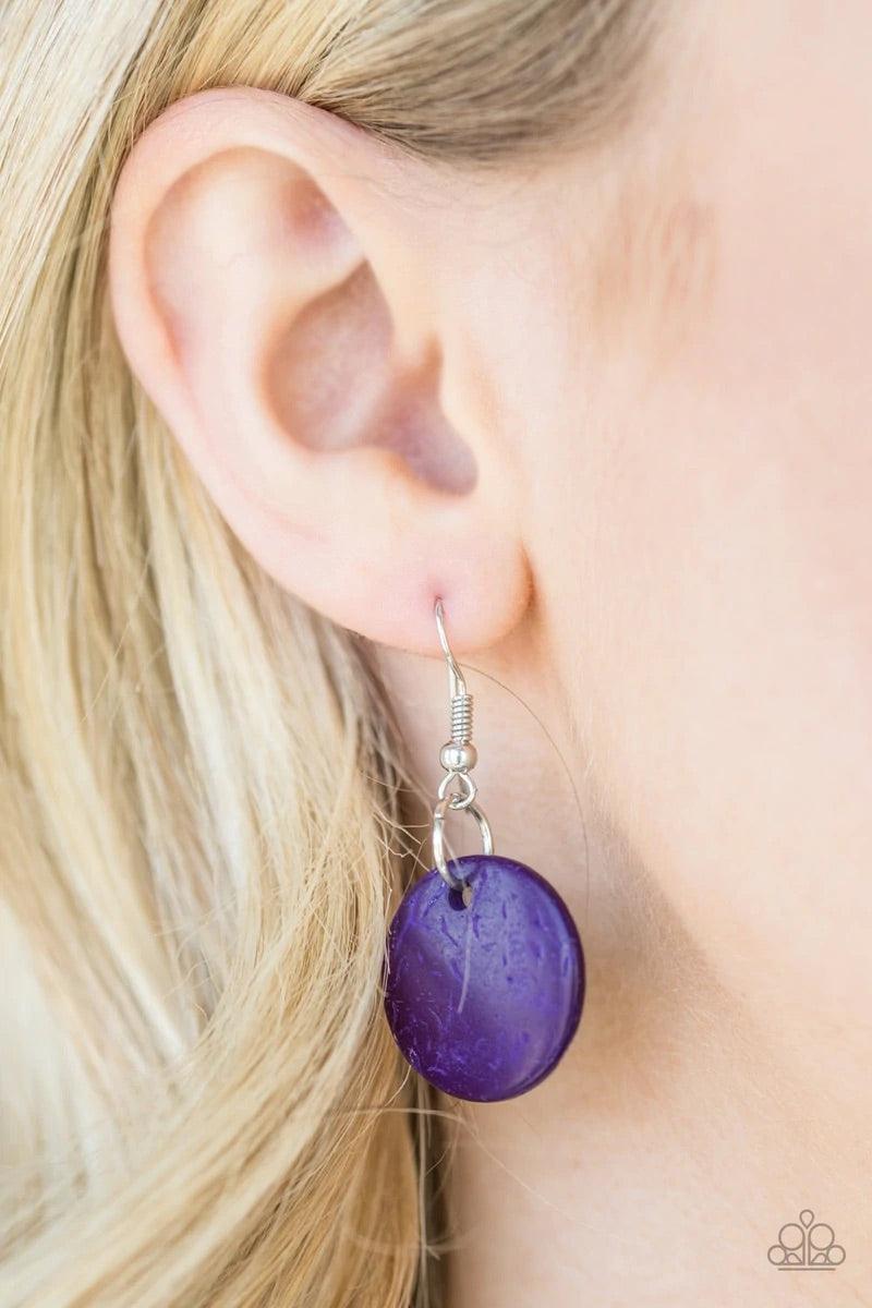 Paparazzi Accessories Pacific Paradise - Purple Featuring abstract geometric finishes, mismatched brown wooden beads and vivacious purple accents are threaded along shiny brown cording. A dramatic geometric bead adorns the center, creating a bold summery