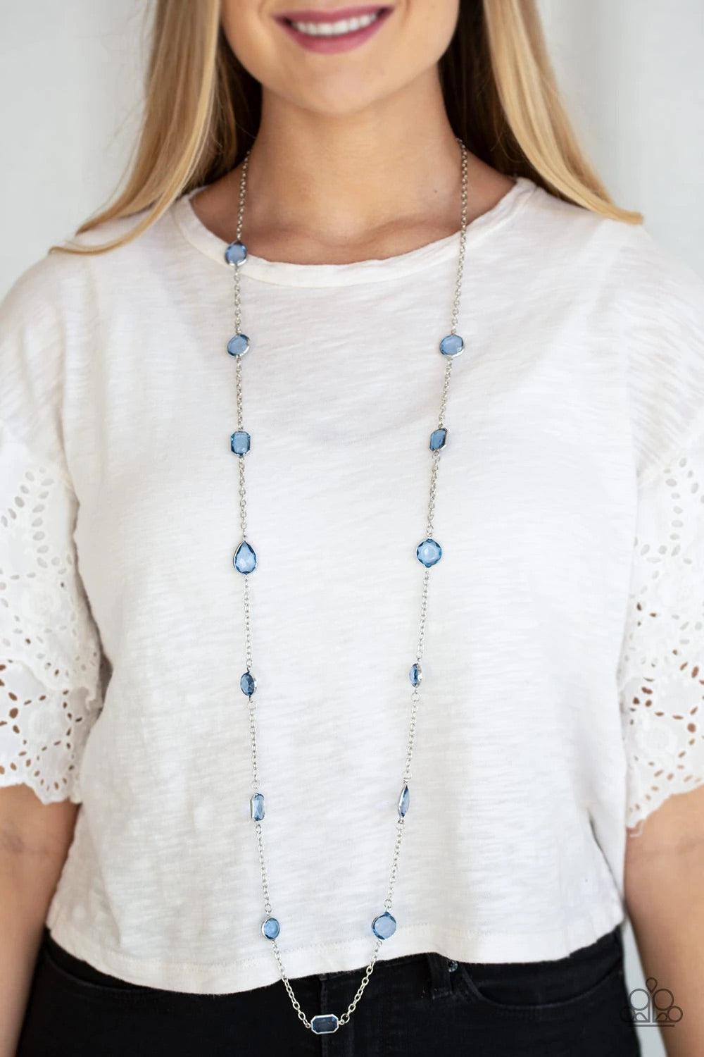Paparazzi Accessories Glassy Glamorous - Blue Featuring sleek silver fittings, an array of glassy Blue Depths gemstones trickle along a shimmery silver chain for a glamorous look. Features an adjustable clasp closure. Sold as one individual necklace. Incl