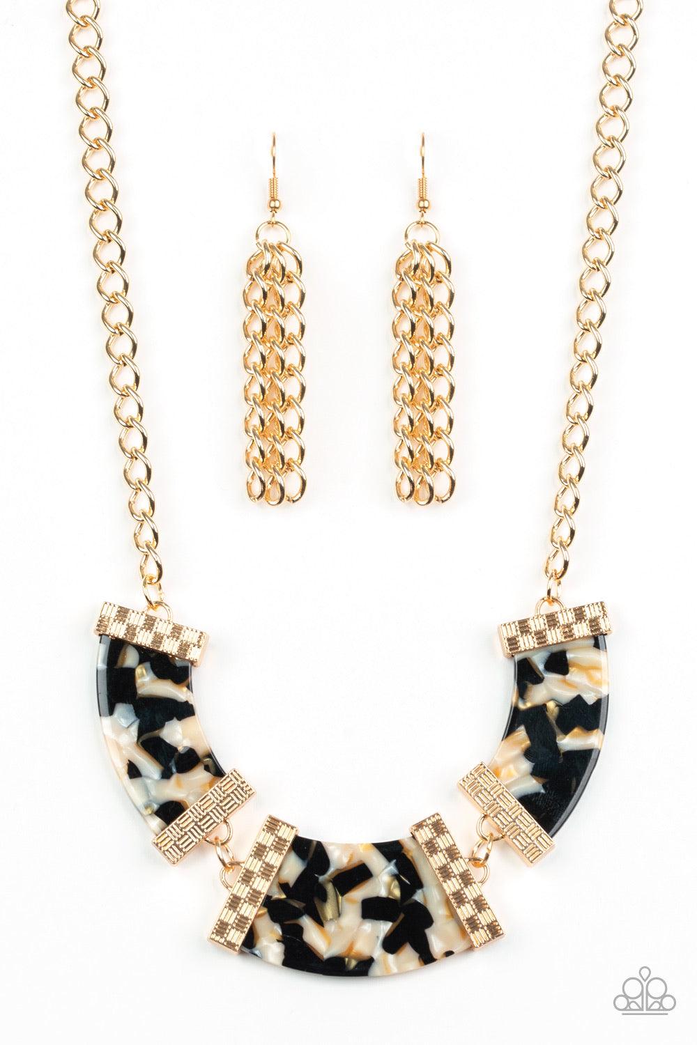 Paparazzi Accessories HAUTE Blooded ~Black A trio of speckled acrylic frames are nestled inside checker textured gold fittings as they link below the collar for a seasonal flair. Features an adjustable clasp closure.