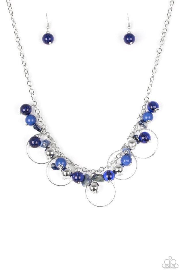 Paparazzi Accessories Mountain Mosaic - Blue Glassy blue, polished blue, and classic silver chains swing from the bottom of a shimmery silver chain. Infused with large silver hoops, bits of tranquil blue rock beading trickle between the beaded accent, cre