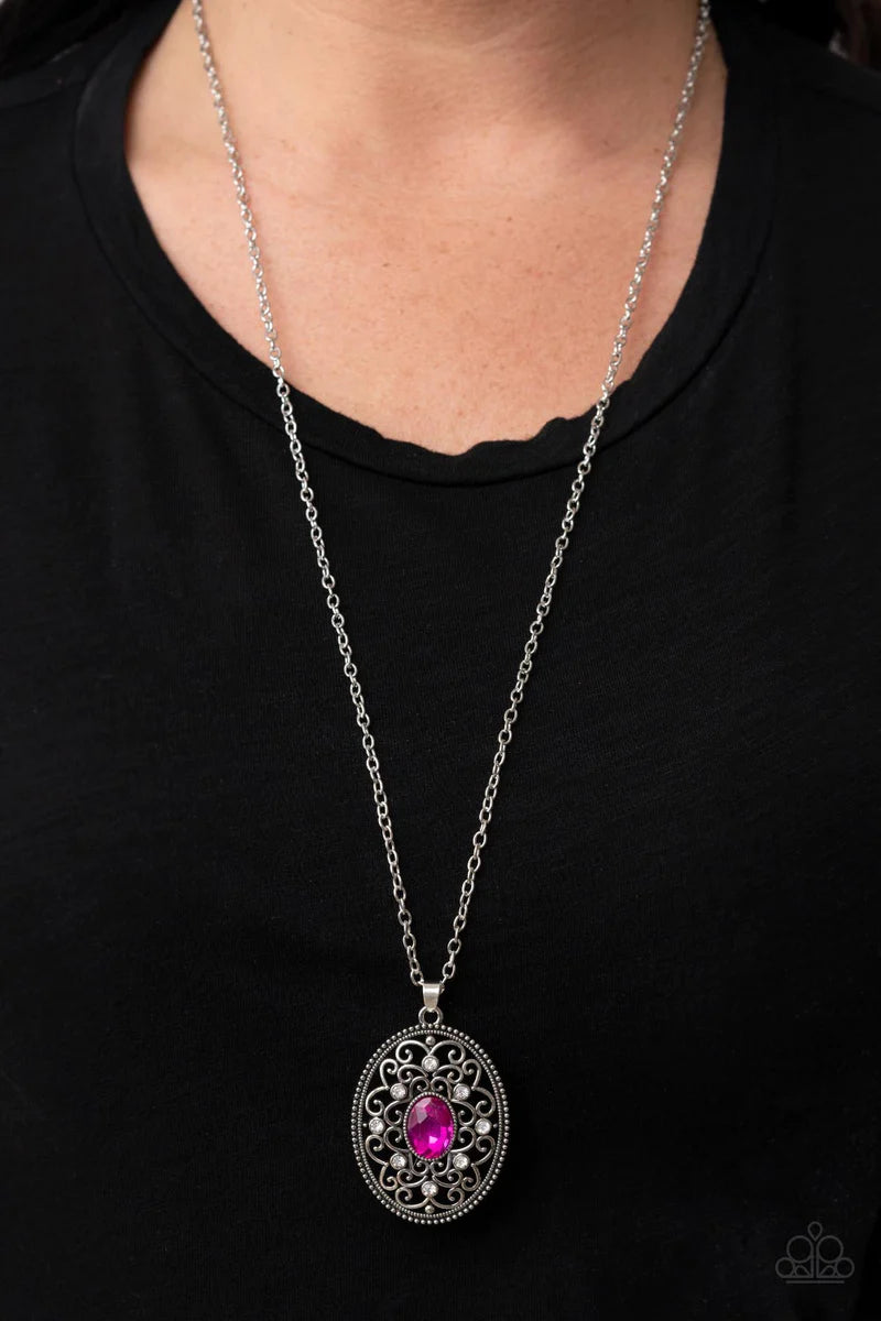 Paparazzi Accessories Sonata Swing - Pink Dainty white rhinestones are sprinkled across silver vine-like filigree that whirls around an oval pink gem center inside of a studded silver frame, resulting in a whimsical pendant at the bottom of a silver chain