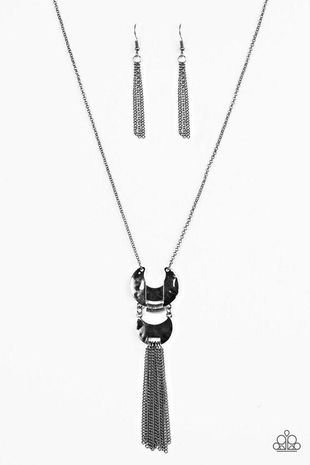 Paparazzi Accessories Lunar Legend - Black Two delicately hammered frames link at the bottom of a shimmery gunmetal frame, creating a stacked pendant. Infused with dainty gunmetal rings, the crescent shaped frames give way to a shimmery chain fringe for a