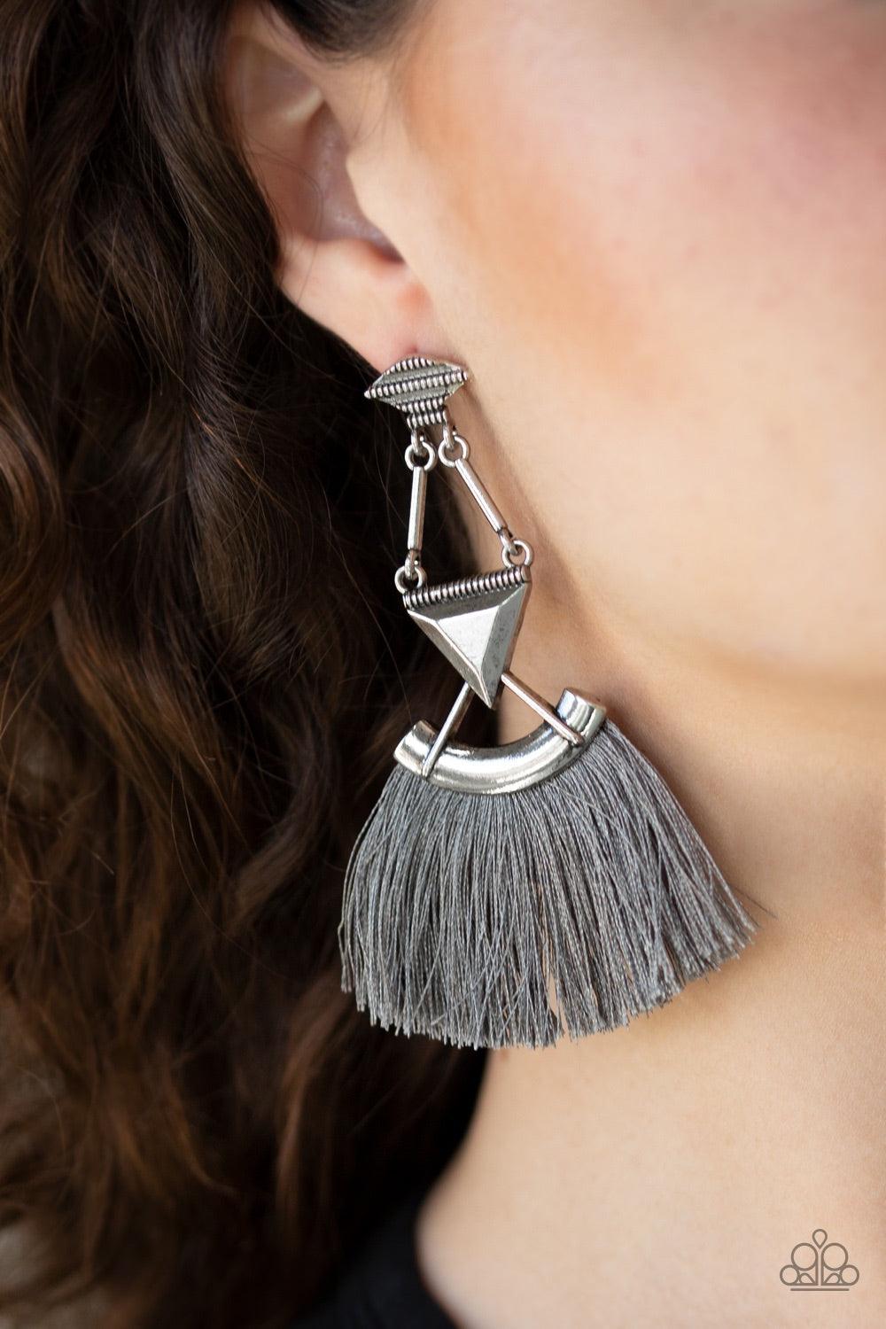 Paparazzi Accessories Puma Prowl - Silver An assortment of geometric silver frames connect into an edgy lure. A fan of shiny gray thread flares from the bottom of the stacked frame for a funky finish. Earring attaches to a standard post fitting. Jewelry
