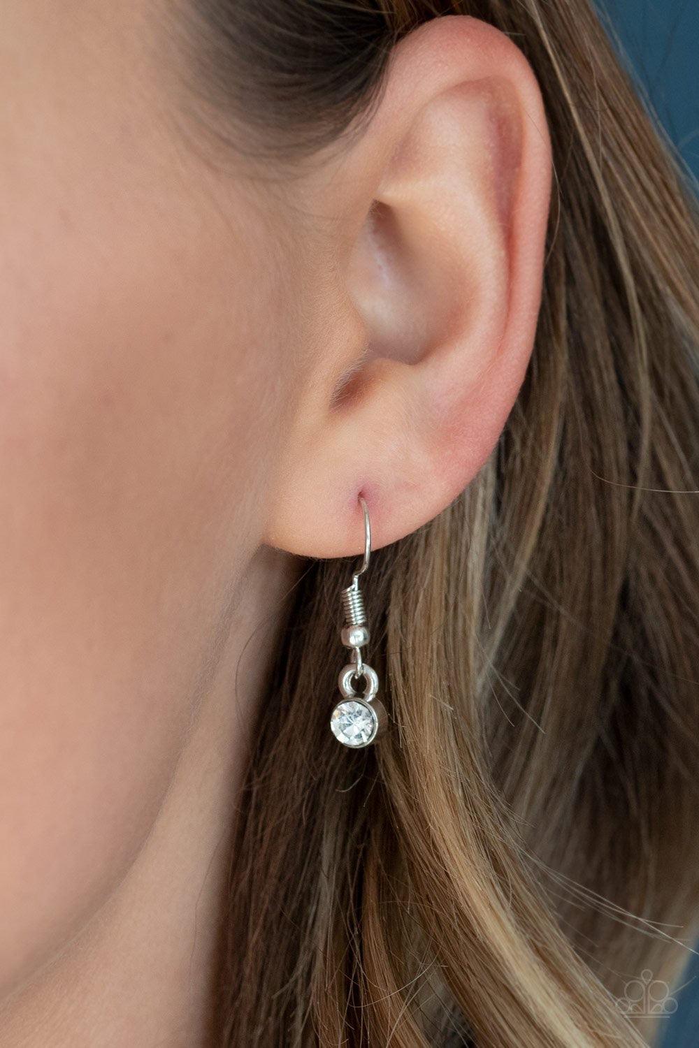 Paparazzi Accessories Gemstone Grandeur - Multi Featuring a raw cut and metallic backing, an iridescent gem swings from the bottom of an elongated silver popcorn chain. Dotted with a dainty white rhinestone, the faceted gem catches and refracts the light