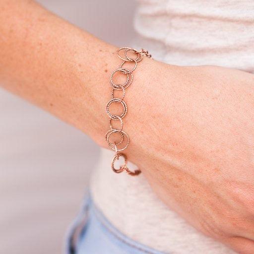 Paparazzi Accessories Team RINGLEADER - Copper Delicately etched in radiant textures, dainty copper rings join around the wrist in a dizzying fashion. Features an adjustable clasp closure. Jewelry