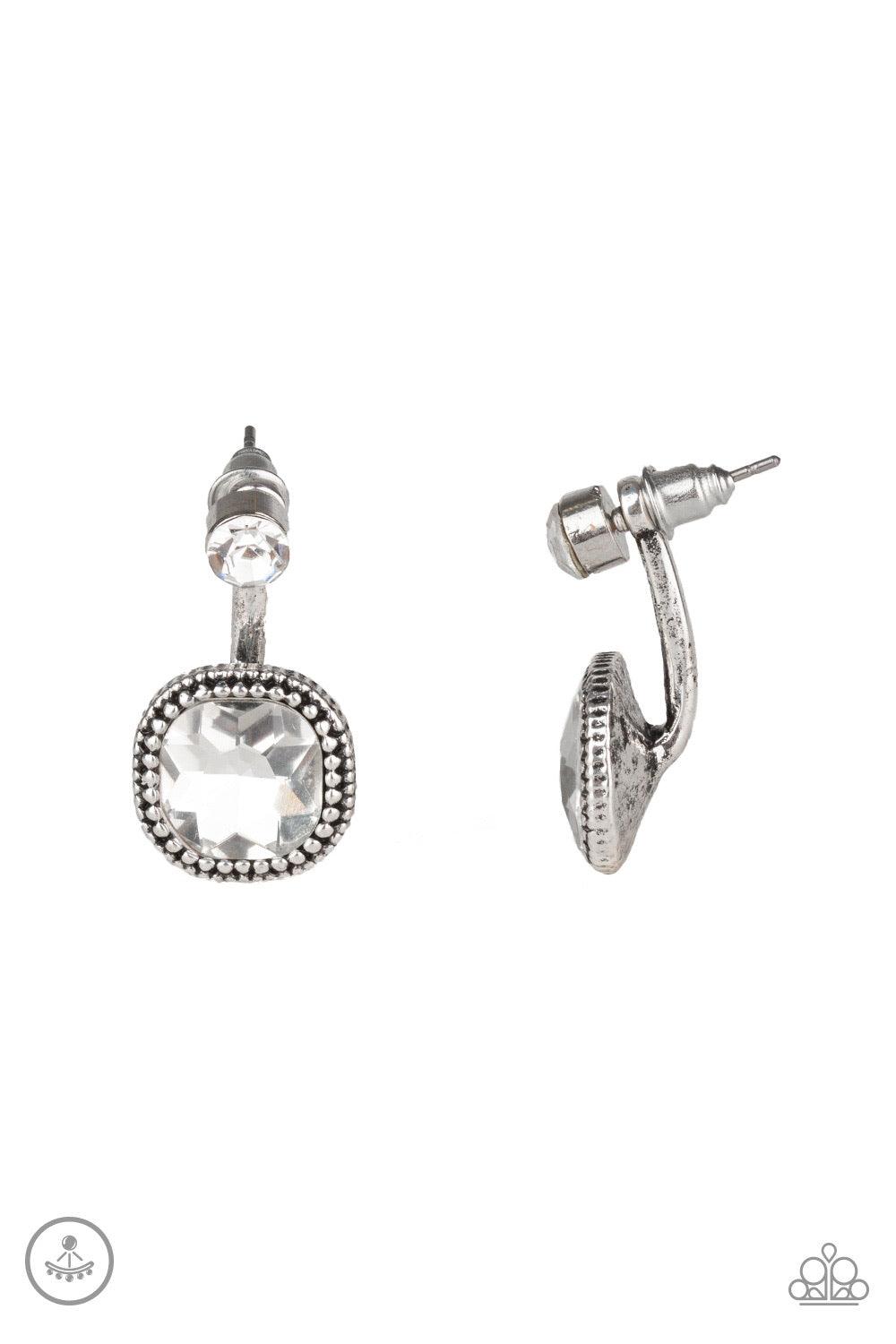 Paparazzi Accessories Celebrity Cache - White A solitaire white rhinestone attaches to a double-sided post, designed to fasten behind the ear. Featuring a faceted white gem, the glitzy double-sided post peeks out beneath the ear for a refined look. Earrin