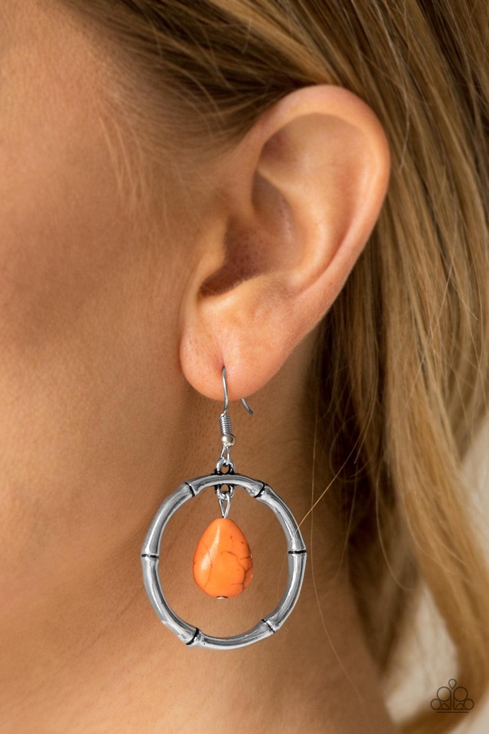 Paparazzi Accessories Stone Style - Orange Chiseled into a tranquil teardrop, an earthy orange stone swings from the top of a textured silver hoop, creating a handcrafted, artisan inspired lure. Earring attaches to a standard fishhook fitting. Jewelry
