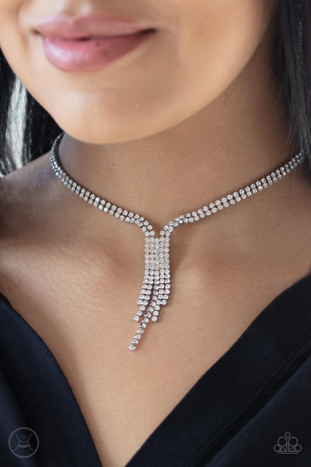 Paparazzi Accessories Double The Diva - White Interlocking strands of glittery white rhinestones wrap around the neck, creating double the drama as solitaire strands of rhinestones drip from a square center for a timelessly tasseled look. Features an adju