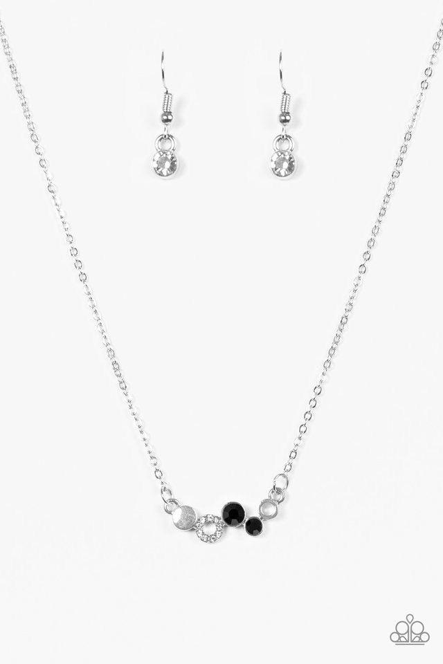 Paparazzi Accessories Champagne Cabaret - Black Shimmery silver accents and glittery white and black rhinestones join into a dainty frame, creating a bubbly pendant below the collar for a timeless look. Features an adjustable clasp closure. Sold as one in
