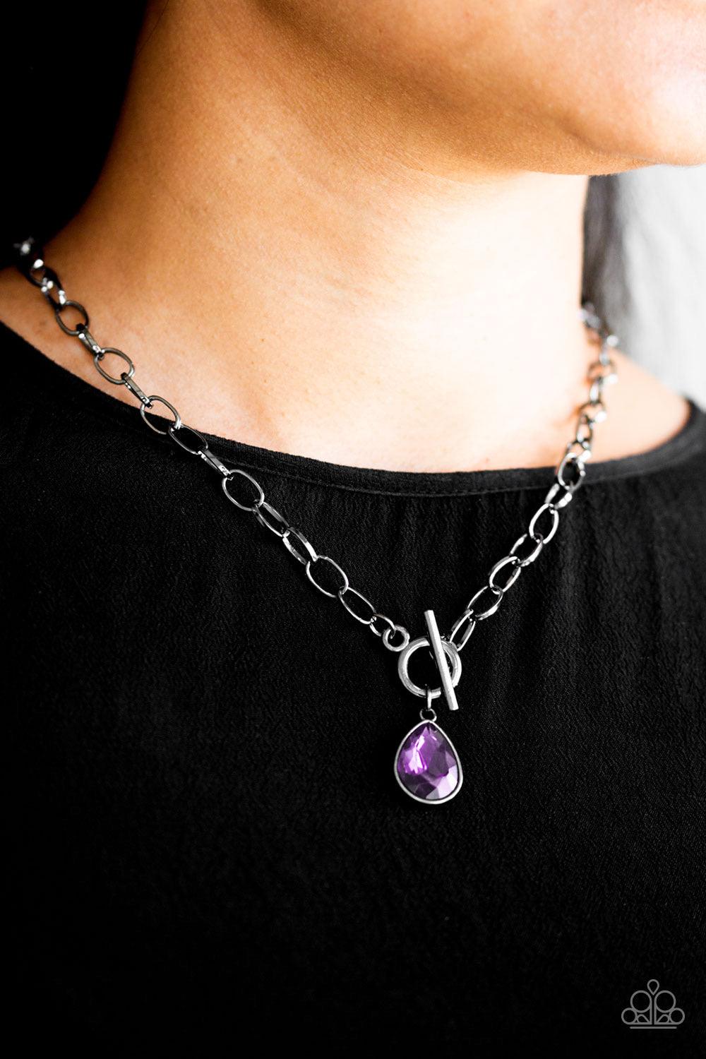 Paparazzi Accessories So Sorority - Purple A faceted purple teardrop gem swings from the bottom of a glistening gunmetal chain, creating a classic pendant below the collar. Features a toggle closure. Sold as one individual necklace. Includes one pair of m