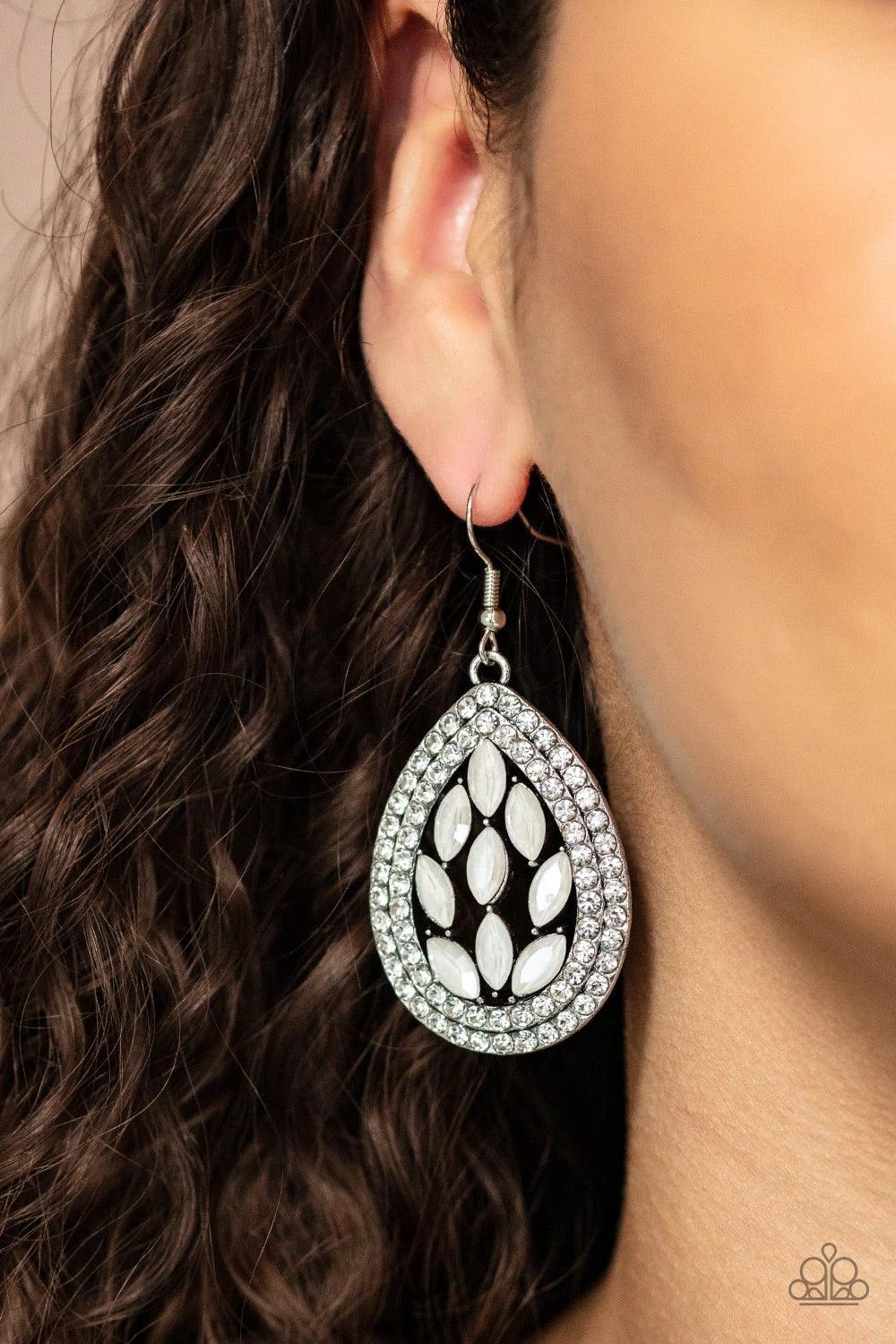 Paparazzi Accessories Encased Elegance - White Iridescent marquise cut rhinestones collect inside two borders of glassy white rhinestones, coalescing into a sparkly teardrop. Earring attaches to a standard fishhook fitting. Sold as one pair of earrings. J