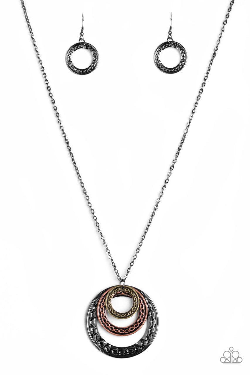 Paparazzi Accessories Savagely She-Wolf - Multi Embossed in swirling tribal detail, brass, copper, and gunmetal frames swing from the bottom of an elongated gunmetal chain, creating an airy stacked pendant. Features an adjustable clasp closure. Jewelry