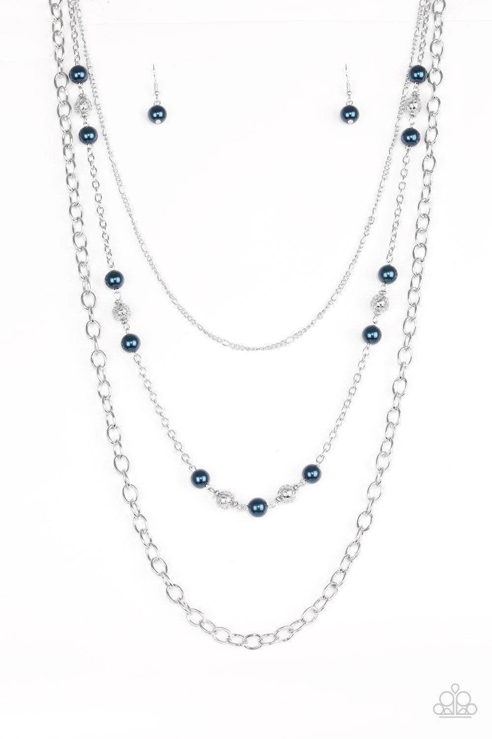 Paparazzi Accessories Classical Cadence - Blue Wrapped in wire mesh, classic silver beads join pearly blue beads along a shimmery silver chain. Varying in size and shimmer, mismatched silver chains layer behind the beaded strand for a refined finish. Feat