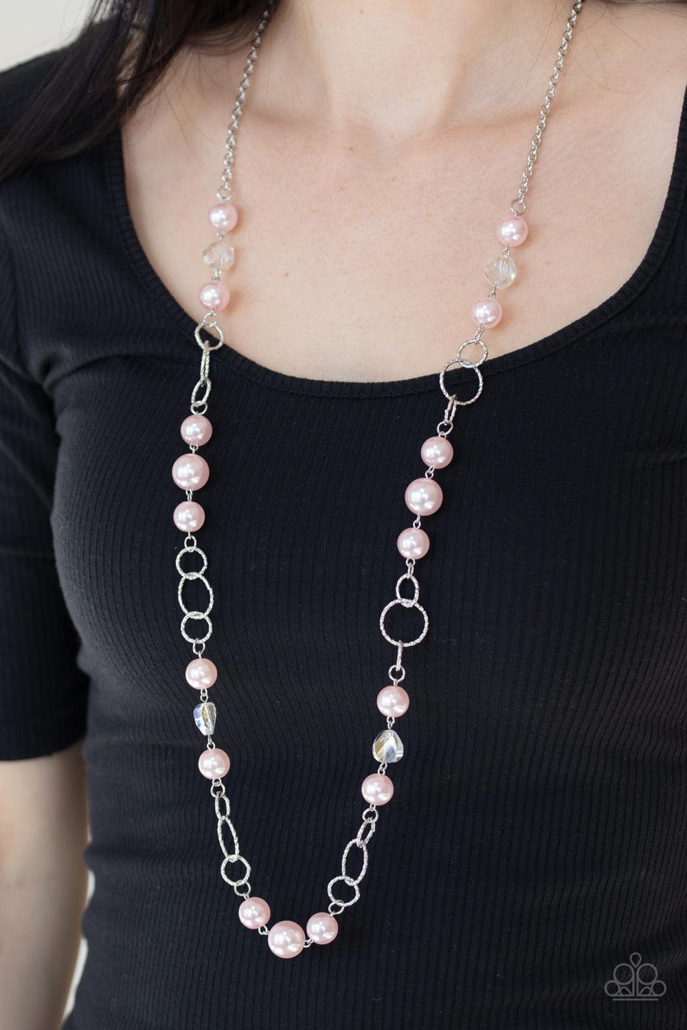 Paparazzi Accessories Prized Pearls - Pink A refined collection of glassy white gems, textured silver rings, and pearly pink beads drape across the chest for a timeless look. Features an adjustable clasp closure. Sold as one individual necklace. Includes