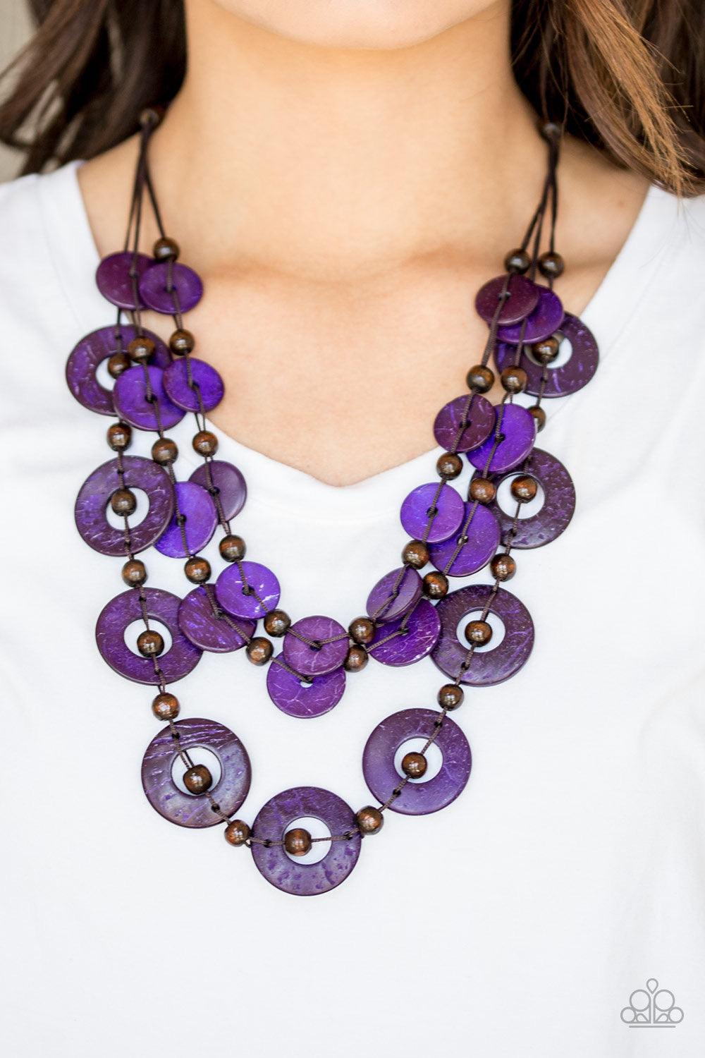 Paparazzi Accessories Catalina Coastin - Purple Brushed in a shell-like iridescence, vivacious purple wooden discs and round brown wooden beads are knotted along three strands of brown cording for a summery look. Features a button loop closure. Jewelry